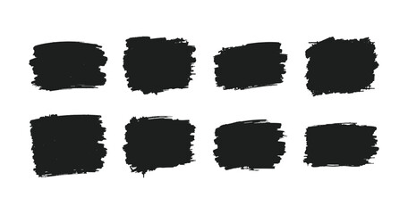 Black distressed grunge brush strokes set on a white background