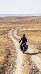 Obraz premium Motorcyclist Navigating Hilly Terrain on an Enduro Motorcycle in the Steppe of Shymkent, Kazakhstan. Generative AI