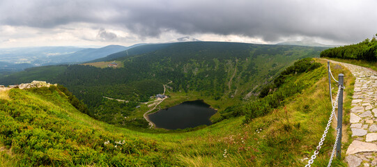 panoramic view on valley with lake in Karkonosze mountains during summer in Poland