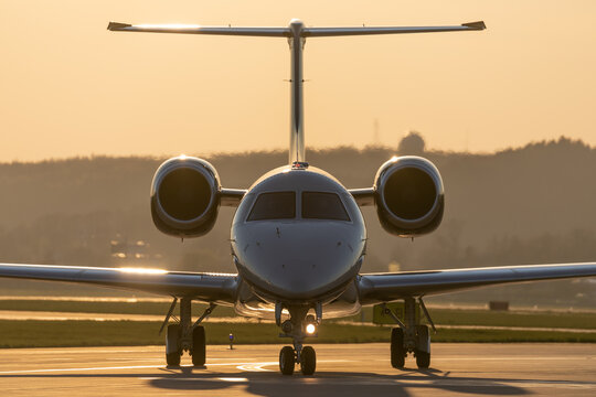 Business jet taxing at airport.