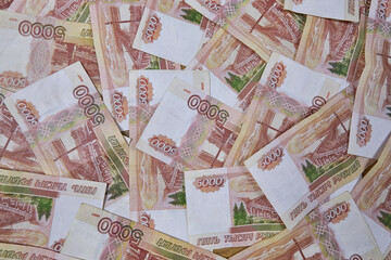 Background of five thousand Russian ruble banknotes, top view, copy space. currency exchange, accumulation of cash, banking system
