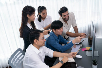 Group of diverse office worker employee working together on strategic business marketing planning in corporate office room. Positive teamwork in business workplace concept. Prudent