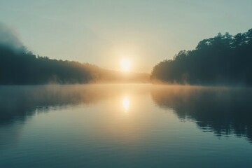 Fototapeta premium Sun Setting over a Foggy Lake with Trees