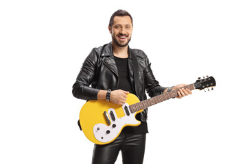 Male musician with a yellow electric guitar