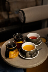 A cozy afternoon with vibrant teas served in elegant cups at a chic café, inviting relaxation and warmth