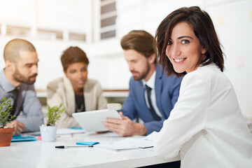 Portrait, smile and woman in boardroom, confident and conversation for financial report and tablet. Collaboration, teamwork and people with paperwork, plan and together for project, actuary or Canada