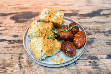 extravagant cuisine, restaurant small plate menu pork sausage and sour dough bread