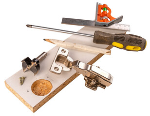 Installing furniture hinges in chipboard. Isolated background.