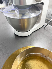 Pastry, baking and cooking concept - woman making cake in kitchen at home. Process of making honey cake