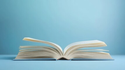 International Literacy Day's open book concept symbolizes learning and education. It represents the importance of literacy and the spread of knowledge globally.