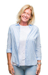 Fototapeta premium Middle age blonde woman over isolated background winking looking at the camera with sexy expression, cheerful and happy face.