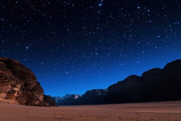 Obraz premium Starry Night Sky Over a Desert Landscape