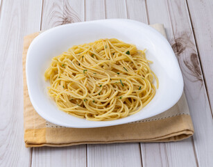 Spaghetti pasta in a plate with garlic and olive oil