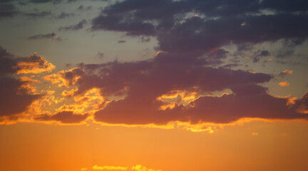 evening hours, at sunset, among the clouds, a sunny landscape