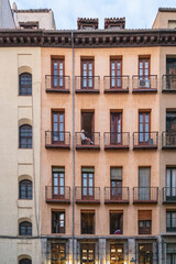 Traditional apartment building facade in Madrid with balconies