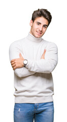 Young handsome man wearing turtleneck sweater over isolated background happy face smiling with crossed arms looking at the camera. Positive person.