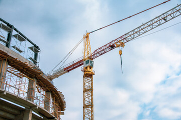 iron crane working in stadium construction