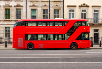 Red double-decker bus on streets of London, UK