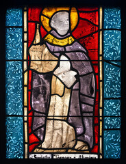 Saint Thomas Aquinas. A stained-glass window in Kościół Świętej Trójcy [Holy Trinity Church]...