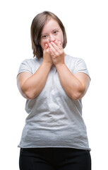 Young adult woman with down syndrome over isolated background shocked covering mouth with hands for mistake. Secret concept.