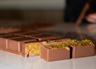 Dubai chocolate, viral chocolate 2024, trends , homemade chocolate with pistachio and kadaif, chocolate in a section