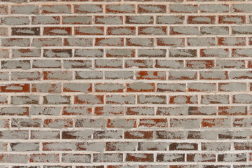 Fototapeta premium Red brick background that has grey paint pattern full copy space. Full frame Red brick background that has grey paint repair pattern for full copy space