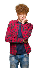 Young handsome student man with afro hair wearing a jacket looking stressed and nervous with hands on mouth biting nails. Anxiety problem.