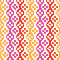 Retro Colorful flowers on hourglass ogee ovals seamless pattern in pink, red and orange on white background. For home decor, textile and wallpaper