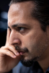 Man in data center checks for server performance issues caused by misconfigured applications....