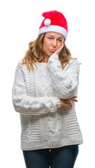 Middle age senior hispanic woman wearing christmas hat over isolated background thinking looking tired and bored with depression problems with crossed arms.