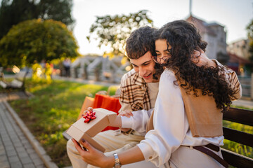 boyfriend surprise girlfriend with special gift after shopping outdoor
