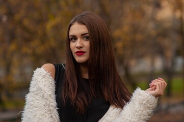 Close up trendy portrait of elegant young woman with big eyes and red lips