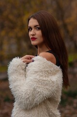 Close up trendy portrait of elegant young woman with big eyes and red lips