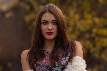 Close up trendy portrait of elegant young woman with big eyes and red lips