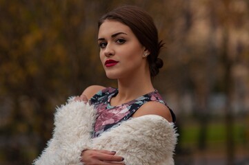 Close up trendy portrait of elegant young woman with big eyes and red lips