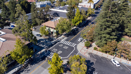 Aerial view of intersection of S Santa Cruz Ave and Broadway in Los Gatos, surrounded by trees and...