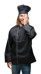 Young handsome cook man with long hair over isolated background covering one eye with hand with confident smile on face and surprise emotion.