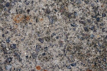 photo of an old wall with a gray stone-like texture