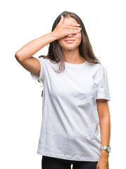 Fototapeta premium Young beautiful arab woman over isolated background smiling and laughing with hand on face covering eyes for surprise. Blind concept.