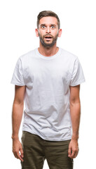 Obraz premium Young handsome man over isolated background afraid and shocked with surprise expression, fear and excited face.