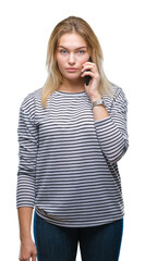 Young caucasian woman showing smartphone screen over isolated background with a confident expression on smart face thinking serious