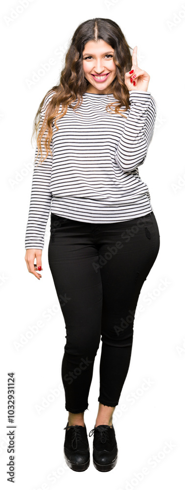 Canvas Prints Young beautiful woman wearing stripes sweater showing and pointing up with finger number one while smiling confident and happy.