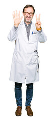 Middle age doctor men wearing medical coat showing and pointing up with fingers number seven while smiling confident and happy.