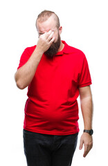 Young caucasian hipster man wearing red shirt over isolated background tired rubbing nose and eyes feeling fatigue and headache. Stress and frustration concept.