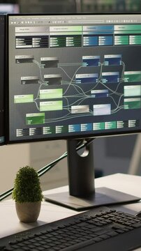Vertical video Empty IT department office used for building artificial intelligence machine learning software technology. Bright modern company workspace with nobody in and devices left open on desks