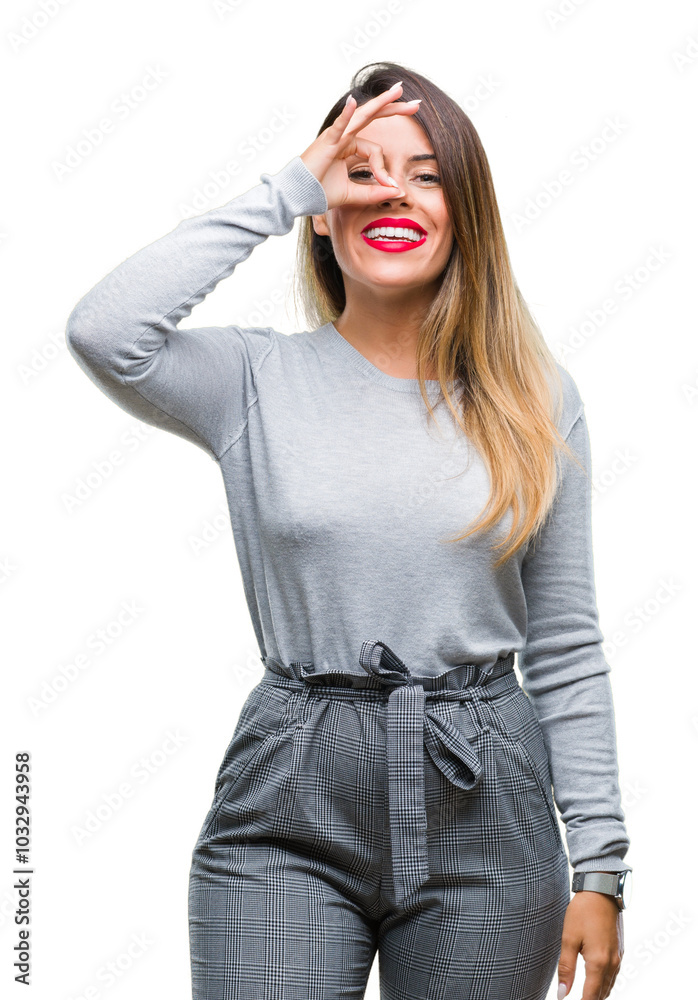 Canvas Prints Young beautiful worker business woman over isolated background doing ok gesture with hand smiling, eye looking through fingers with happy face.