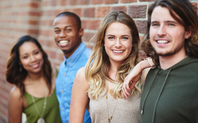 People, happy and portrait at brick wall for travel, journey and relationship development. Friends, couples and smile on city sidewalk for double date, friendly support and students on study break