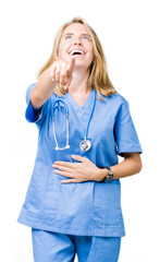 Beautiful young doctor woman wearing medical uniform over isolated background Laughing of you,...