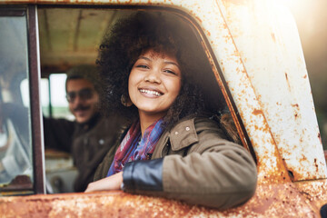 Woman, truck and portrait by window on road trip with man, partner and happy in sunshine for adventure. Girl, people and driving in rusty vehicle for journey, travel and transportation in Costa Rica