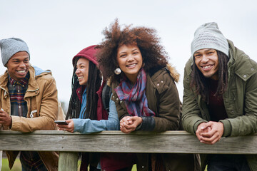 Friends, bridge and outdoor portrait in forest, autumn holiday and countryside for bonding. People,...